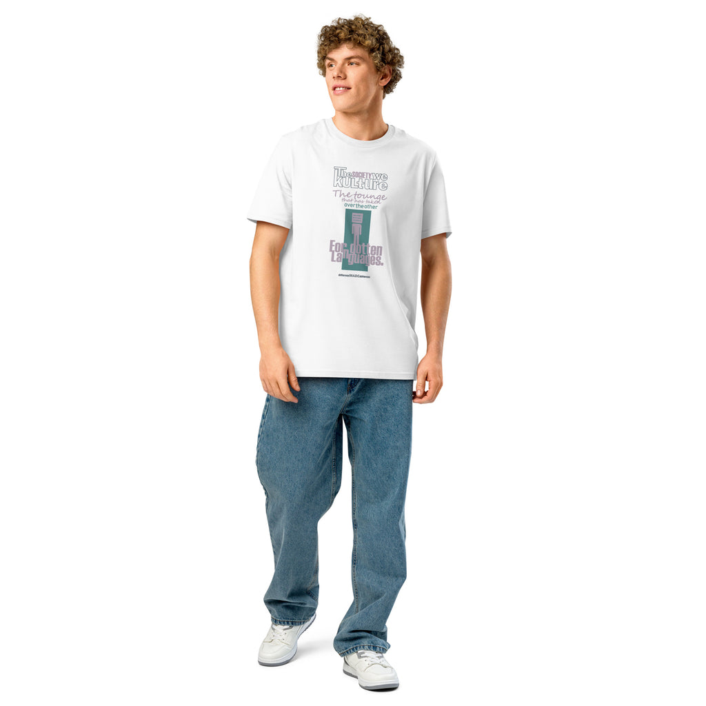 Full-body studio view of a male model wearing the white "Forgotten Languages" organic cotton t-shirt and blue jeans, highlighting the versatile, relaxed fit.